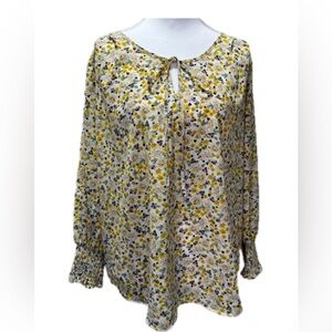 PLEIONE FLORAL LONG SLEEVE BLOUSE WITH SMOKED CUFF AND TIE NECK. SIZE: M